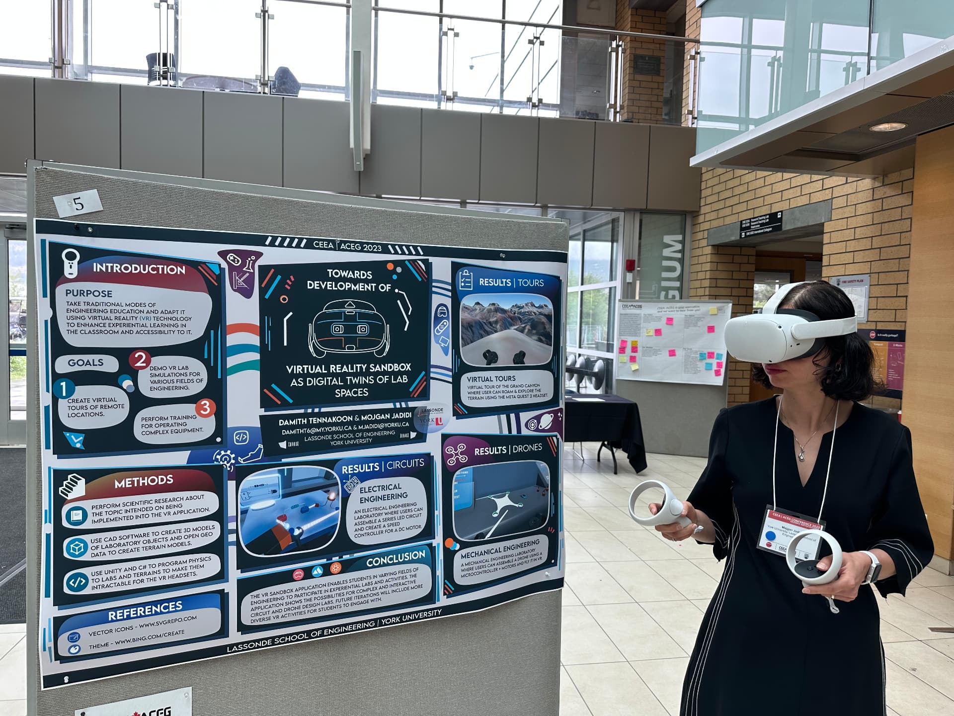 Mojgan Jadidi demonstrating VR beside a digital-twin research poster