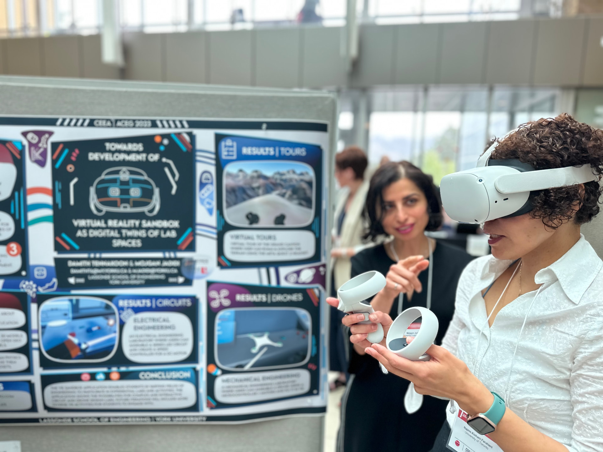 An immersive-learning demonstration beside a research poster